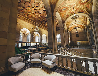 three empty gray armchairs inside building thumbnail