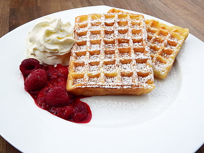 waffle with raspberries on plate thumbnail
