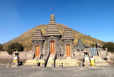 gray and brown towers near mountain thumbnail