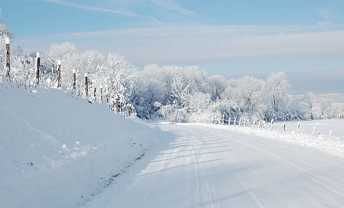 road with snow during daytime thumbnail