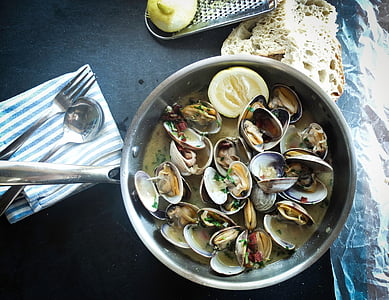 seafoods in clear glass bowl on table thumbnail