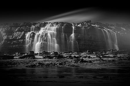grayscale photography of waterfalls thumbnail