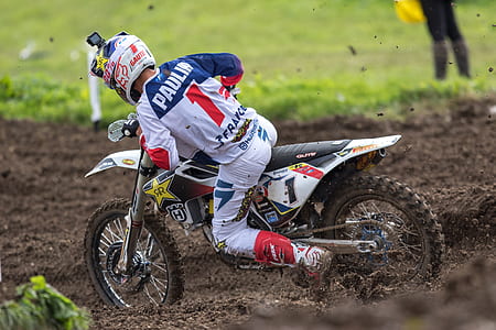 man riding on motocross dirt bike thumbnail