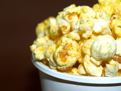 popcorn on white bucket in close-up photo thumbnail