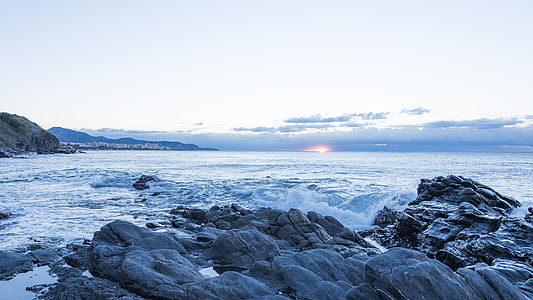 photo of ocean and mountains thumbnail