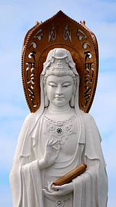 white and brown statue of woman under white sky thumbnail