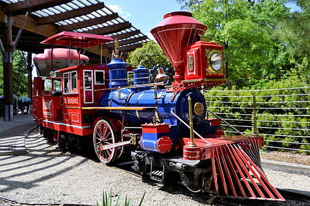 red and black train on rail thumbnail