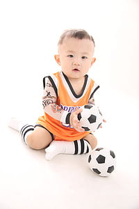 boy holding soccer ball thumbnail