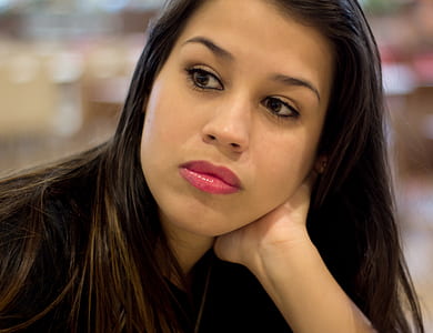 focus photo of woman in black shirt thumbnail