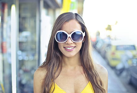 Woman Wearing Yellow Spaghetti Strap Top and Round Sunglasses thumbnail