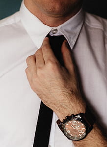 man arranging necktie thumbnail