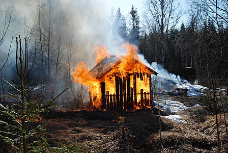 brown wooden shed burning in flames thumbnail