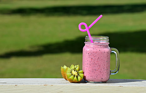 shallow focus photography of clear mason jar with kiwi during daytime thumbnail