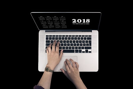 person touching MacBook Pro thumbnail