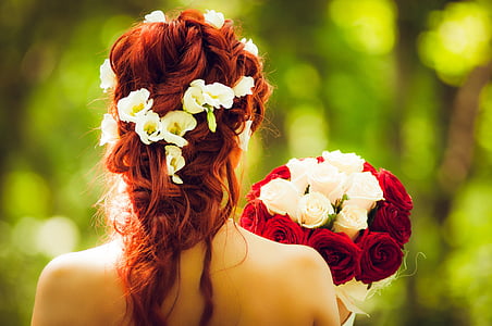 woman holding red and white flower boquet thumbnail