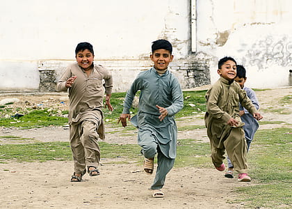 four boys running thumbnail