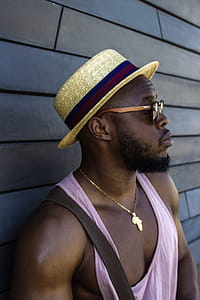 Man Wearing Hat and Pink Tank Top thumbnail
