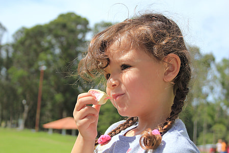 girl holding food thumbnail