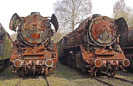 two brown trains on railway thumbnail