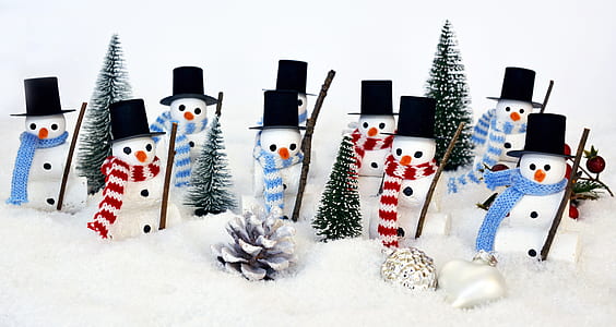 snowman figurines on snow thumbnail