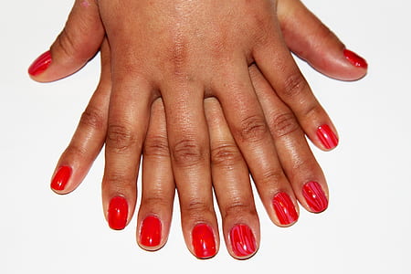 red nail polished manicure thumbnail