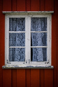 closed white casement window with curtain thumbnail