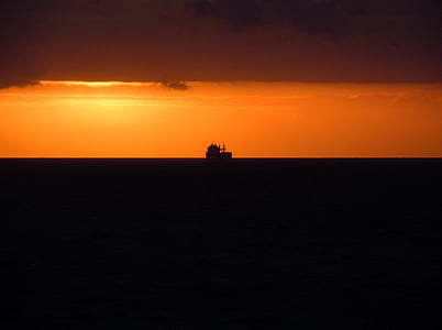 silhouette of fishing boat during sunset thumbnail