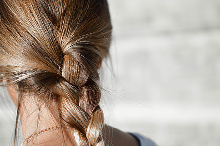 close view of brown tinted braided hair thumbnail