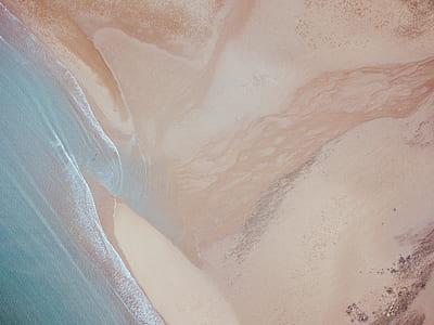 photo of shore and sand at daytime thumbnail