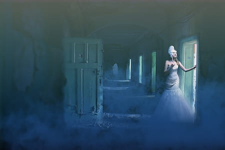 woman in white gown standing at the front of white door thumbnail
