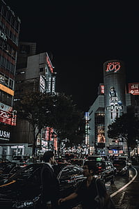 two person standing near cars in street thumbnail