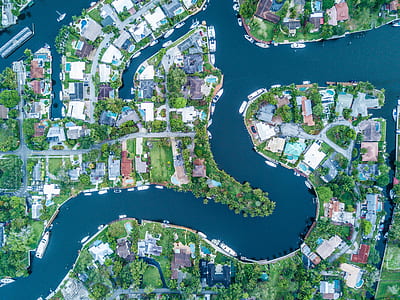 birds eye photography of town near body of water thumbnail