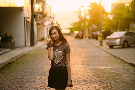 woman stands in the middle of road thumbnail