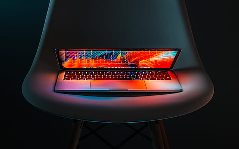 white laptop computer on chair thumbnail