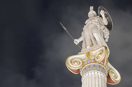 Athena statue view from base during nighttime thumbnail