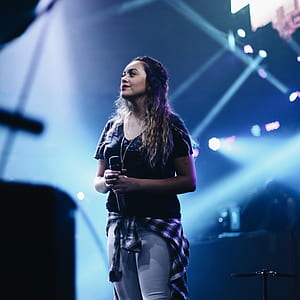 woman holding microphone thumbnail
