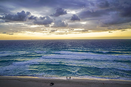 photo of body of water under white clouds at daytime thumbnail