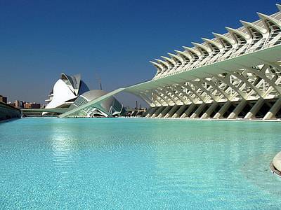 green water pool across white concrete building at daytime thumbnail