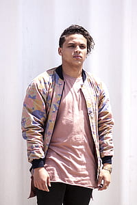 man in pink, purple, and brown jacket thumbnail