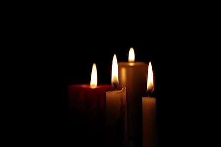 four lighted candles thumbnail