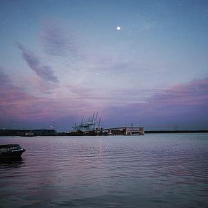 calm body of water during nighttime \ thumbnail