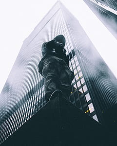 man standing on surface edge thumbnail