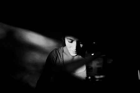 grayscale photography of a woman wearing gray scoop neck top thumbnail