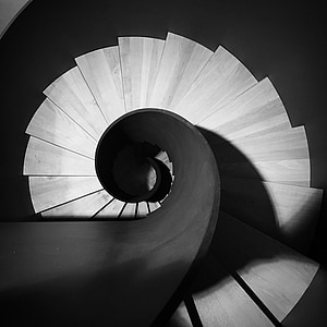 grayscale photo of spiral stairs thumbnail