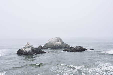 rock formations in body of water thumbnail