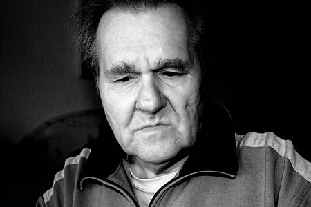 grayscale of man in zip-up jacket thumbnail