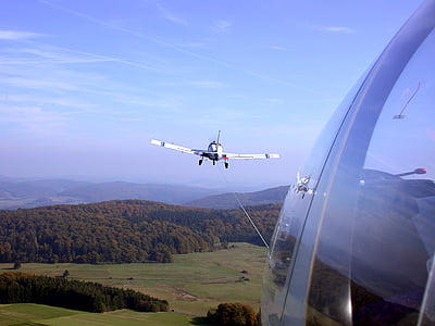 white airplane on mid air at daytime thumbnail