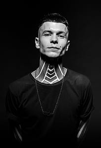 grayscale photo of man wearing crew-neck t-shirt thumbnail