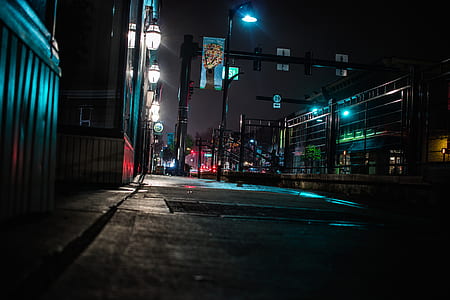 low angle photography of lighted city street thumbnail
