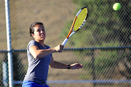 person playing tennis during daytime thumbnail